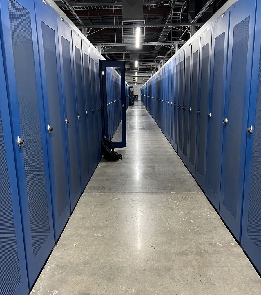 Rows of server cabinets in the data center behind the CVI network